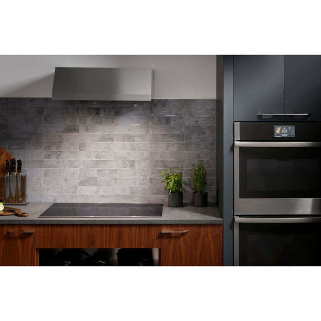GE-PHP9030DTBB-Modern kitchen with an induction cooktop and range hood
