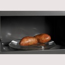 GE-PVM9215SKSS-two sweet potatoes placed on a rotating glass tray